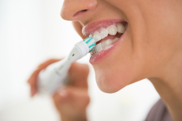 Can I Use An Electric Toothbrush With Dental Implants? - Dental Implant  Center